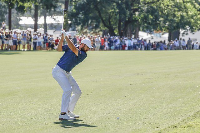 Cameron Young hits a shot on the 16th fairway in his foursomes match at the Presidents Cup golf championship in Charlotte, North Carolina on Saturday, September 24, 2022. Photo by Nell Redmond