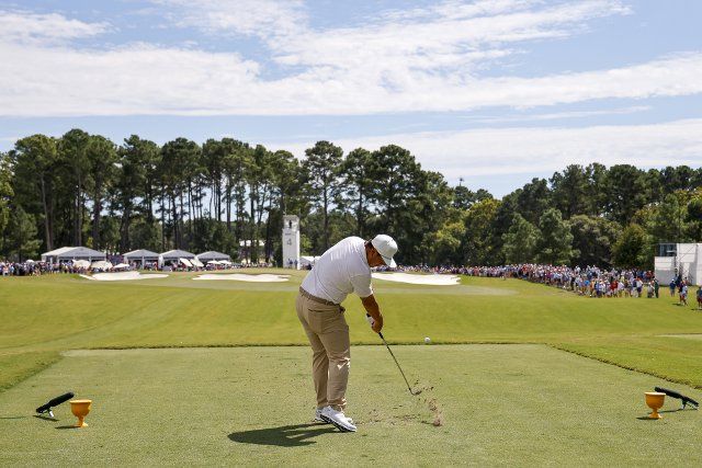 Sungjae Im, of South Korea, hits his tee shot on the fourth hole during four-ball match play at the Presidents Cup golf championship in Charlotte, North Carolina on Saturday, September 24, 2022. Photo by Nell Redmond