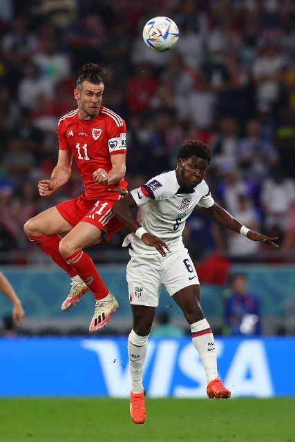 Yunus Musah (R) of USA in action with Gareth Bale of Wales during the 2022 FIFA World Cup Group B match at the Ahmad Bin Ali Stadium in Doha, Qatar on November 21, 2022. Photo by Chris Brunskill