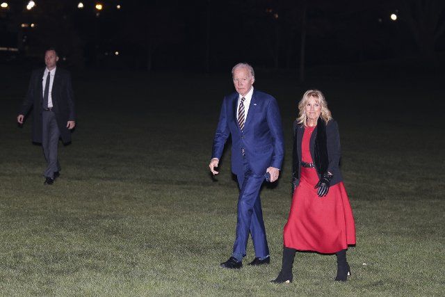 President Joe Biden and first lady Dr.Jill Biden walk on the South Lawn of the White House on Monday, November 21, 2022 in Washington, DC after returning from a trip to Cherry Point, North Carolina, where they participated in a Friendsgiving dinner with service members and military families.. Photo by Oliver Contreras