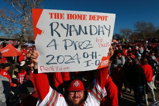 An Ohio State Buckeyes fan holds a sign prior to the Buckeyes game against the Michigan Wolverines in Columbus, Ohio on Saturday, November 26, 2022. Photo by Aaron Josefczyk