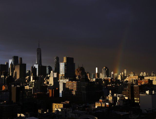 A morning rainbow appears over the Manhattan skyline just after sunrise in New York City on Monday, November 28, 2022. Photo by John Angelillo