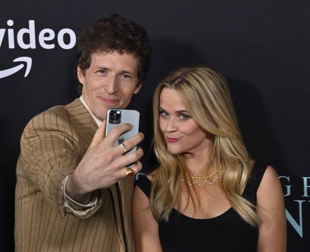 Director Daryl Wein (L) takes a selfie with producer Reese Witherspoon during the premiere of Prime Video\