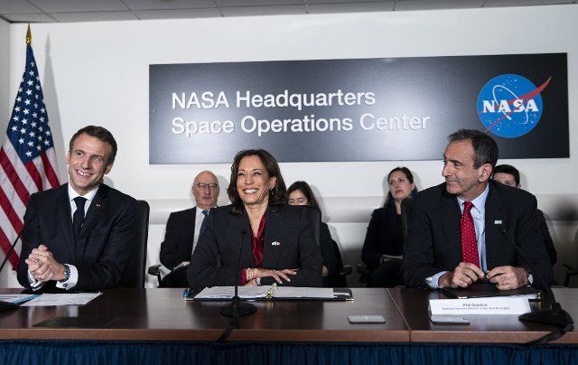 French President Emmanuel Macron speaks alongside Vice President Kamala Harris and Phil Gordon, National Security Advisor to the Vice President (R) during a briefing at the NASA headquarters in Washington, DC, on Wednesday, November 30, 2022. President Joe Biden will welcome Macron for the first White House state dinner in more than three years on Thursday. Photo by Al Drago