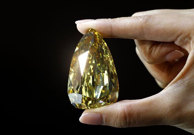 The Golden Canary, a colossal 303.10 carat fancy deep brownish yellow diamond andÊthe largest flawless or internally flawless diamond in the world estimated in excess of $15 Million, is on display at a preview of Luxury Week Auctions at Sotheby\