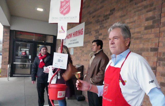 Former St. Louis Cardinals pitcher Rick Horton rings bells for the Salvation Army, collecting money for the Tree of Lights Campaign in St. Louis on Friday, December 2, 2022. Photo by Bill Greenblatt