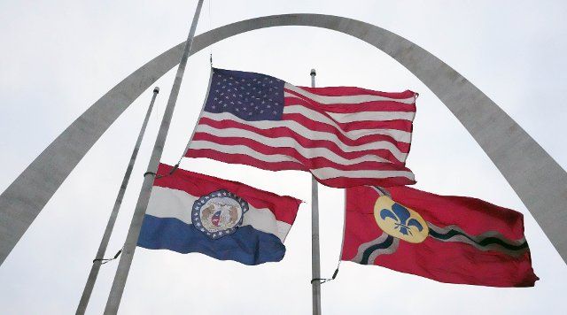 The flags near the Gateway Arch are fully extended as winds blow from the southwest blow 15 to 25 mph with gusts up to 45 mph in St. Louis on Friday, December 2, 2022. Portions of south central, southwest, west central Illinois, central, east central, northeast, and southeast Missouri are all under a wind advisory until 12\/3\/2022. Photo by Bill Greenblatt