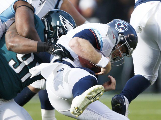 Tennessee Titans quarterback Ryan Tannehill is sacked in the first quarter by Philadelphia Eagles Javon Hargrave in week 13 of the NFL season at Lincoln Financial Field in Philadelphia on Sunday, December 4, 2022.. Photo by John Angelillo