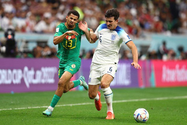 Harry Maguire (R) of England in action with IIliman Ndiaye of Senegal during the 2022 FIFA World Cup Round of 16 match at Al Bayt Stadium in Al Khor, Qatar on December 04, 2022. Photo by Chris Brunskill