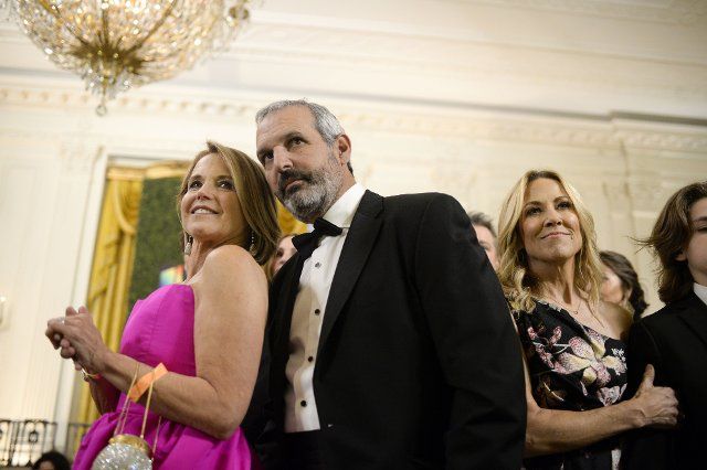 American Journalist Katie Couric, her husband, John Molner, and Musician Sheryl Crow (L-R) look on as President Joe Biden and First Lady Jill Biden arrive to a reception for Kennedy Center Honorees in the East Room of the White House in Washington, DC on Sunday, December 4, 2022. The Honorees are George Clooney, Singer Gladys Knight, singer-songwriter Amy Grant, Knight, composer Tania Leon, and Irish rock band U2, comprised of band members Bono, The Edge, Adam Clayton, and Larry Mullen Jr. Photo by Bonnie Cash