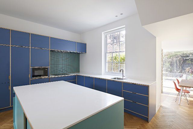 Kitchen interior with island. Queens House, London, United Kingdom. Architect: Paul Archer Design - Architects & Design, 2021