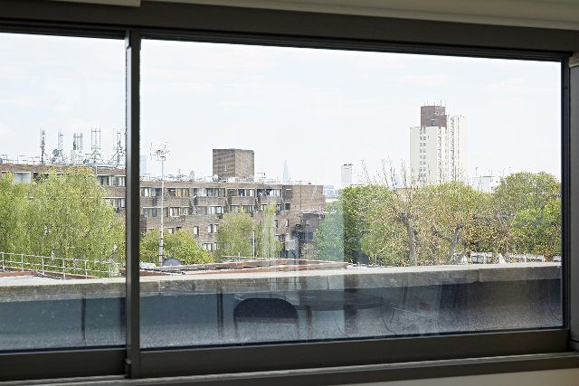 Window view towards neighbourhood. Queens House, London, United Kingdom. Architect: Paul Archer Design - Architects & Design, 2021