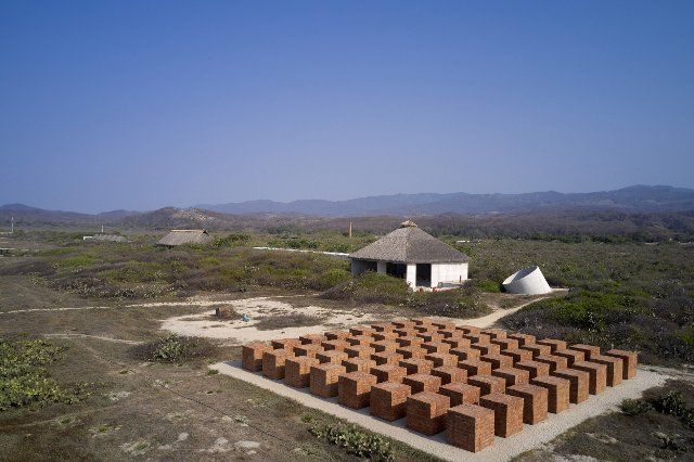 High level view of Casa Wabi with brick sculpture. Atlantes Pavillion at Casa Wabi 2022, Puerto Esondido, Mexico. Architect: Tadao Ando, 2022