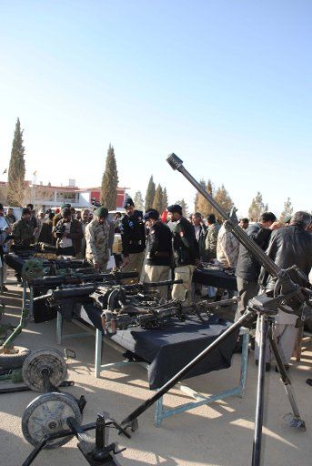 (101223) -- QUETTA Dec. 23 2010 (Xinhua) -- Pakistani security officers display seized arms ammunition and explosives to media in Quetta southwest Pakistan Dec. 23 2010. Pakistani security force on Thursday seized a large quantity of arms ...