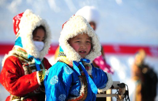 (110102) -- HOHHOT Jan. 2 2011 (Xinhua) -- Photo taken on Dec. 31 2010 shows children attending an ice and snow carnival in Xilingol of north China\