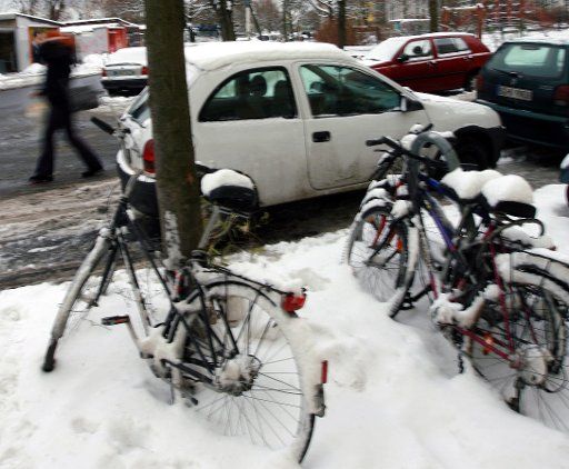 (101210) -- BERLIN Dec. 10 2010 (Xinhua) -- Bicycles are covered with snow in Berlin Germany Dec. 10 2010. The cold weather brought snowfall as well as travel difficulties to the some parts of the country. (Xinhua\/Lou Huanhuan) (yc)