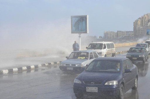 (101211) -- ALEXANDRIA Dec. 11 2010 (Xinhua) -- Vehicles run on a street in a dust storm in Alexandria Egypt Dec. 11 2010. Egyptian authorities closed the port of Alexandria due to the weather.(Xinhua\/Karem Ahmad) (zf)