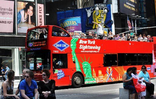 (110104) -- NEW YORK Jan. 4 2011 (Xinhua) -- Tourists visit the Times Square on a tour bus in this file photo taken in New York the United States on May 2 2010. New York City attracted a record high of 48.7 million visitors in 2010 an increase ...