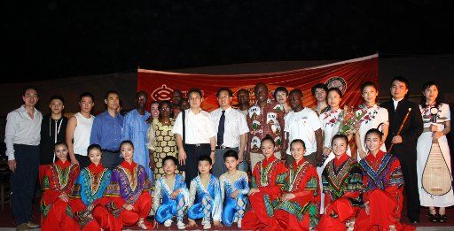 (110207) -- PORTO-NOVO Feb. 7 2011 (Xinhua) -- Actors from China pose for photos with local officals and actors in Porto-Novo Benin Feb. 5 2011. Actors from Shanghai Art Troupe of China performed for Beninese people in Porto-Novo on Saturday. (...