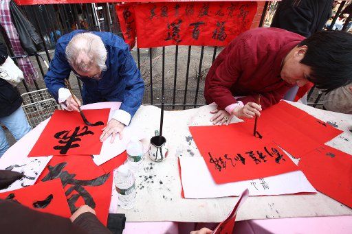 (110217) -- NEW YORK Feb. 17 2011 (Xinhua) -- Chinese calligraphers write Spring Festival scrolls for local residents at the China Town in New York the United States Feb. 17 2011. A grand celebration was held here on Thursday to mark the ...