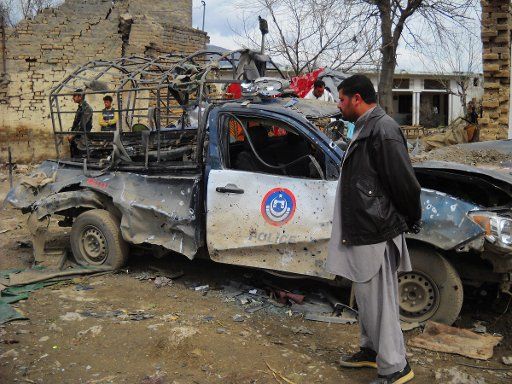 (110303) -- HANGU March 3 2011 (Xinhua) -- A man stands next to a destroyed police van at the blast site in Hangu a main city in Khyber Pakhtoonkhwa province March 3 2011. A suicide bomb blast targeting a police station in northwest Pakistan\