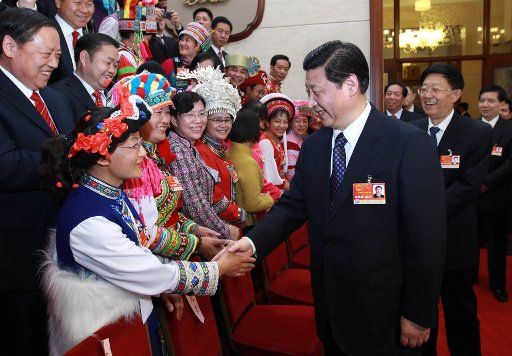 (110310) -- BEIJING March 10 2011 (Xinhua) -- Chinese Vice President Xi Jinping (R Front) who is also a member of the Standing Committee of the Political Bureau of the Communist Party of China (CPC) Central Committee visits deputies to the ...