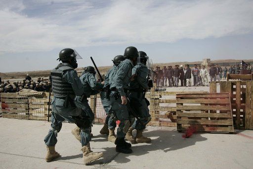 (110311) -- KABUL March 11 2011 (Xinhua) -- Afghan police officers show their abilities in arresting insurgents and controlling the demonstrations in western Herat province of Afghanistan March 10 2011. Two hundred police officers received ...