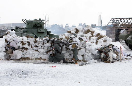 (110220) -- MINSK Feb. 20 2011 (Xinhua) -- Belarusian soldiers re-enact a battle between Soviet Union and Nazi Germany during the World War Two in the suburbs of Minsk Belarus Feb. 20 2011. The historical re-enactment was held to mark the ...