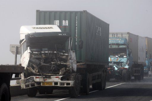 (110222) -- SHANGHAI Feb. 22 2011 (Xinhua) -- Photo taken on Feb. 22 2011 shows damaged vehicles on a cross-sea bridge in Shanghai east China. The pile-up involving more than 10 vehicles on a cross-sea bridge in Shanghai early Tuesday has caused ...