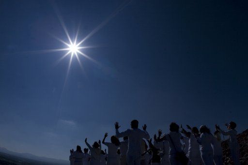 (110321) -- TEOTIHUACAN March 21 2011 (Xinhua) -- A group of people gather on the top of the Piramyd of the Sun in Teotihuacan Mexico March 21 2011. Every year thousand of visitors come to the site to take part in an ancient prehispanic ritual ...