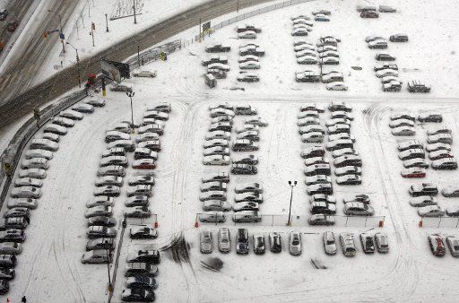 (110323) -- TORONTO March 23 2011 (Xinhua) -- Cars are covered by snow in a parking lot during a snowfall in Toronto Canada March 23 2011. (Xinhua\/Zou Zheng) (zw)