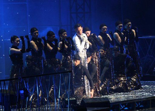 (110327) -- NANTONG March 27 2011 (Xinhua) -- Singer Jacky Cheung (C) performs during his "1\/2 century" tour concert in Nantong east China\