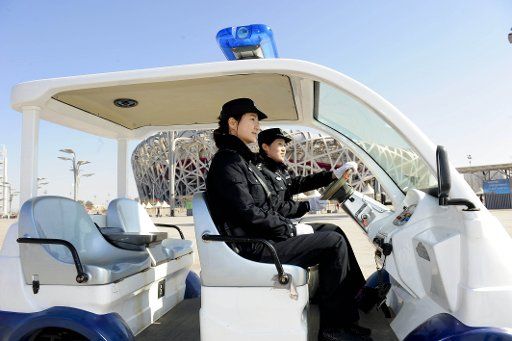 (110315) -- BEIJING March 15 2011 (Xinhua) -- Two female police patrol near the National Stadium also known as the "Bird\