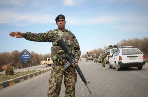 (110318) -- HERAT (AFGHANISTAN) March 18 2011 (Xinhua) -- An Afghan National Army soldier stands guard in Herat\