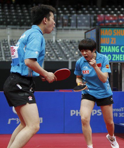 (110513) -- ROTTERDAM May 13 2011 (Xinhua) -- Zhang Chao (L) and Cao Zhen of China celebrate after winning the final of mixed doubles against their compatriots Hao Shuai and Mu Zi in World Table Tennis Championships (WTTC) at Ahoy Arena in ...