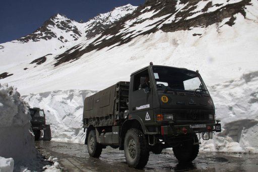 (110502) -- SRINAGAR May 2 2011 (Xinhua) -- Vehicles pass through the Zojila mountain pass 108 kilometres north of Srinagar summer capital of Indian-controlled Kashmir on May 2 2011. The Srinagar-Leh road link in Indian-controlled Kashmir is ...