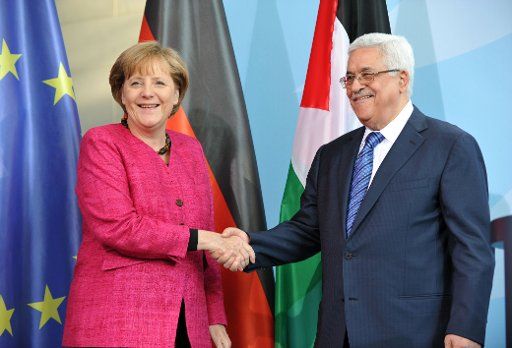 (110506) -- BERLIN May 6 2011 (Xinhua) -- German Chancellor Angela Merkel (L) shakes hands with visiting Palestinian President Mahmoud Abbas during a news conference in Berlin Germany May 5 2011. German Chancellor Angela Merkel on Thursday ...