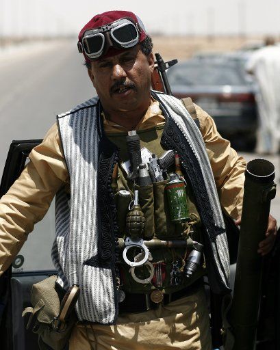 (110511)-- AJDABIYA May 11 2011 (Xinhua) -- A Libyan rebel fighter is seen in the city of Ajdabiya eastern Libya May 10 2011. According to media sources NATO forces attacked the Libyan capital Tripoli in the night of May 9. The target of the ...