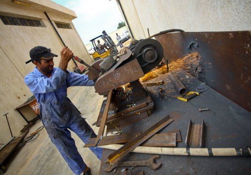 (110716) -- MISURATA July 16 2011 (Xinhua) -- Workers are seen in a local plant making weapons for a battle between rebel fighters and Gaddafi forces in Misurata Libya July 16 2011.(Xinhua\/Amru Salahuddien) (lfj)