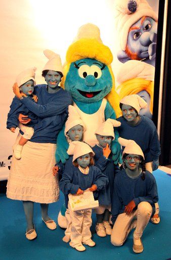 (110626) -- BRUSSELS June 26 2011(Xinhua) -- People dress as Smurfs pose for pictures in Brussels Belgium on June 25 2011. A total of 4617 people from 12 countries took part in the simultaneous Smurf gatherings in Brussels attempt to break a ...
