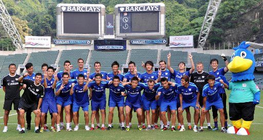 (110725) -- HONG KONG July 25 2011 (Xinhua) -- Team members of Kitchee pose for photo after the training session for the Barclays Asian Trophy in Hong Kong south China July 25 2011. The Barclays Asia Trophy will be held in Hong Kong Stadium ...