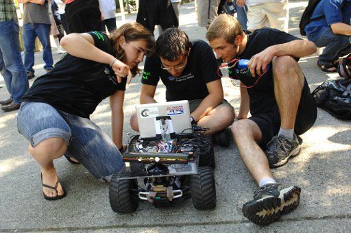 (110724) -- VANCOUVER July 24 2011 (Xinhua) -- Students from the University of Calgary prepare their robotic vehicle for the 7th annual International Autonomous Robot Racing Competition in Vancouver Canada on July 23 2011. Robotic vehicles ...
