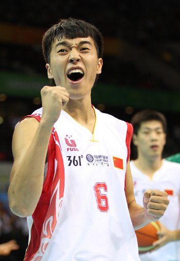 (110815) -- SHENZHEN Aug. 15 2011 (Xinhua) -- Zeng Lingxu of China celebrates a score during the preliminary group A bastkeball match against Brazil at the 26th Summer Universiade in Shenzhen a city of south China\