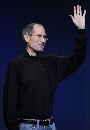 (110824) -- SAN FRANCISCO Aug. 24 2011 (Xinhua) -- Apple Inc. CEO Steve Jobs waves during the launch of the iPad 2 in San Francisco the United States in this March 2 2011 file photo. Jobs has resigned as the chief executive officer (CEO) of ...