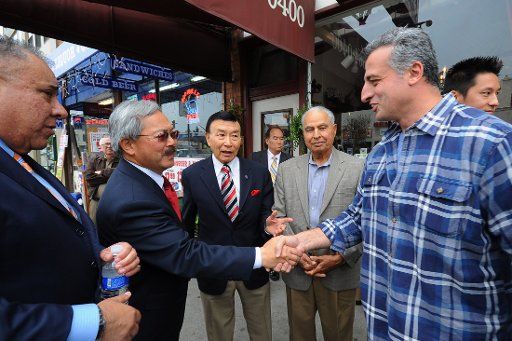 (110809) -- SAN FRANCISCO Aug. 9 2011 (Xinhua) -- Edwin Lee (2nd L) interim mayor of San Francisco talks with a resident in Sunset District San Francisco on Aug. 8 2011. Edwin Lee on Monday formally announced his decision to run for a full ...