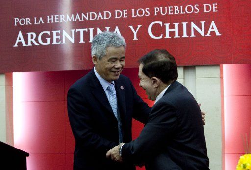 (110811) -- BUENOS AIRES Aug. 11 2011 (Xinhua) -- Chinese Ambassador to Argentina Yin Hengmin (L) expresses his congratulations to Norberto Feldman president of the Argentina-China Friendship Association in Buenos Aires Argentina Aug. 11 2011....
