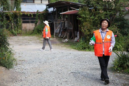 (110910) -- FUKUSHIMA Sept. 10 2011 (Xinhua) -- Residents patrol in an village to protect the belongings of the evacuees in Fukushima prefecture northern Japan Sept. 10 2011. Around 6000 villagers were evacuated from the village about 40 ...