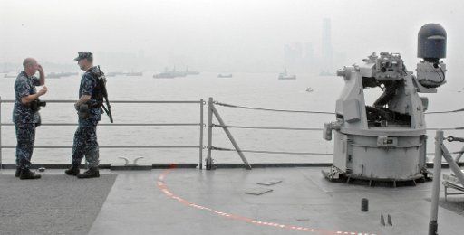 (110902) -- HONG KONG Sept. 2 2011 (Xinhua) -- Two soldiers talk on the deck of the Comstock dock landing ship in Hong Kong south China Sept. 2 2011. The Comstock an amphibian dock landing ship started its visit to Hong Kong on Aug. 31 and ...