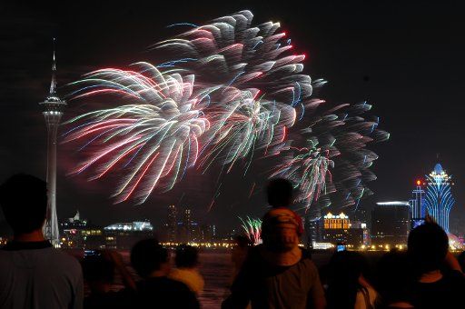 (111001) -- MACAO Oct. 1 2011 (Xinhua) -- Fireworks explode over the sky near the Macao Tower in Macao south China Oct. 1 2011. Macao held the 23rd International Fireworks Display Contest to celebrate the 62nd anniversary of the founding of the ...