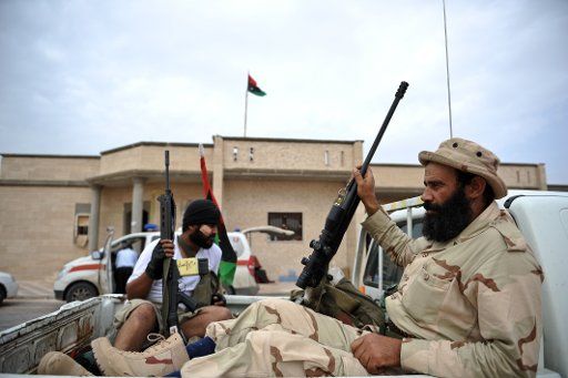 (111009) -- SIRTE Oct. 9 2011 (Xinhua) -- National Transitional Council fighters rest at the front line of Sirte Libya Oct. 8 2011. A total of 17 fighters of Libya\